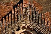 Bagan Myanmar. Dhammayangyi temple. Stucco decorations of window pediments. 